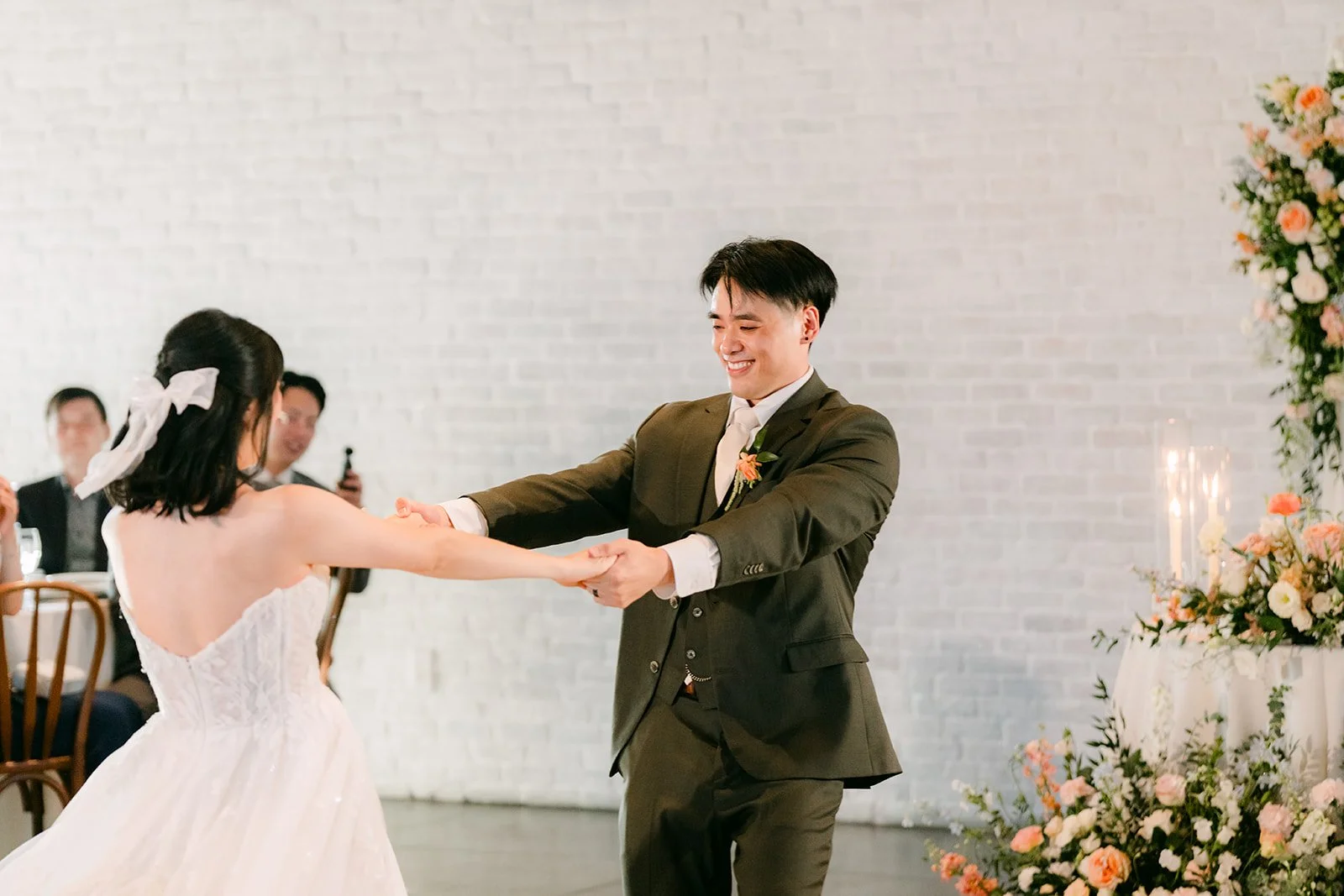 Alex leading Vivian through an underarm turn
