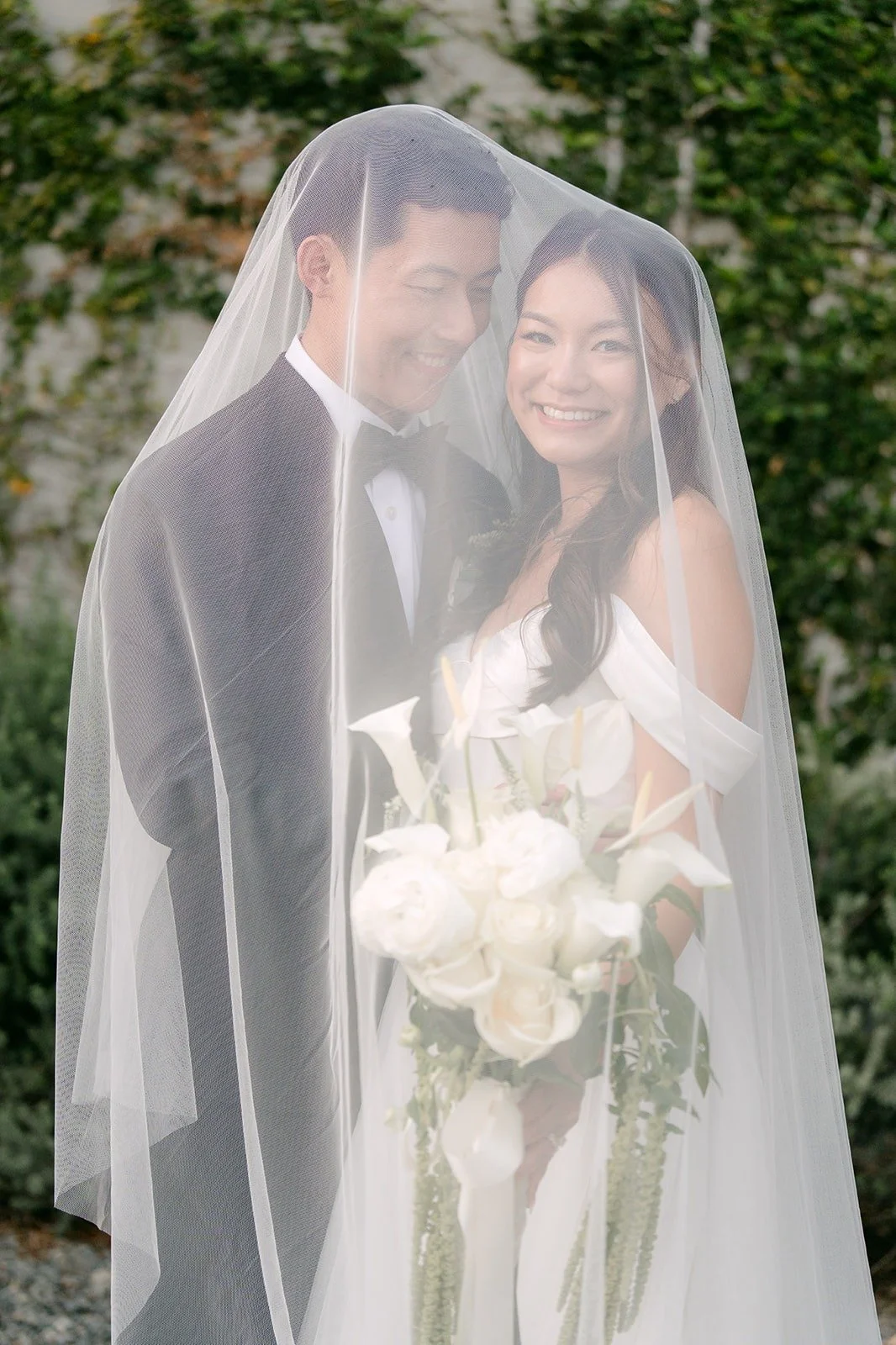 Richard holding Jadee close under the veil
