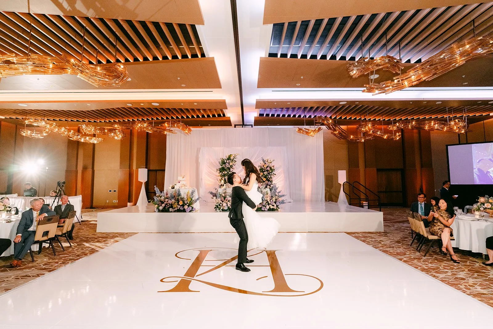 Bride twirling across the monogram dance floor