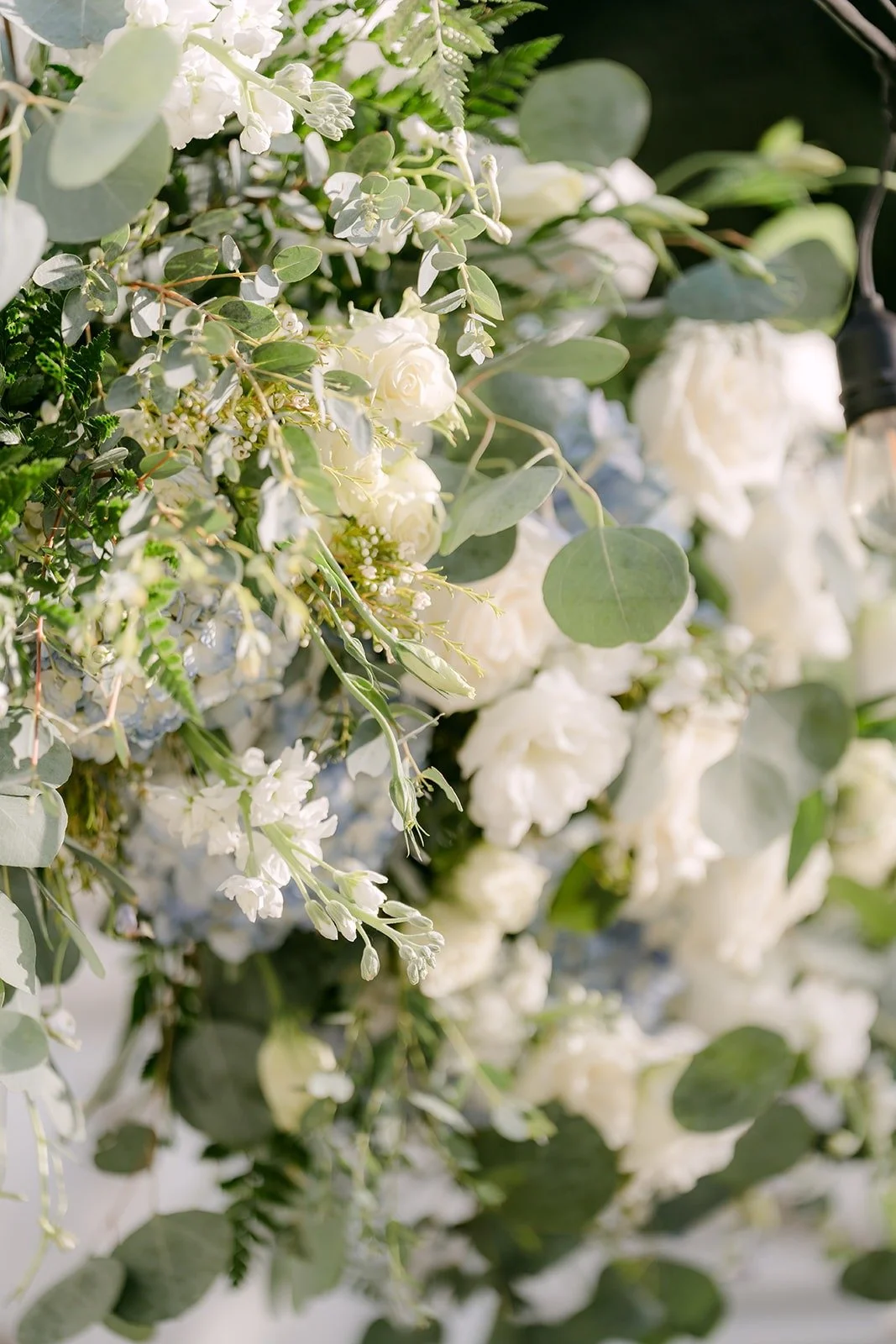 Close up of white and blue florals at the ceremony