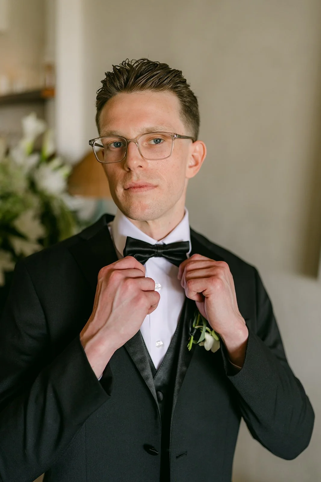 Matthew adjusting his bow tie
