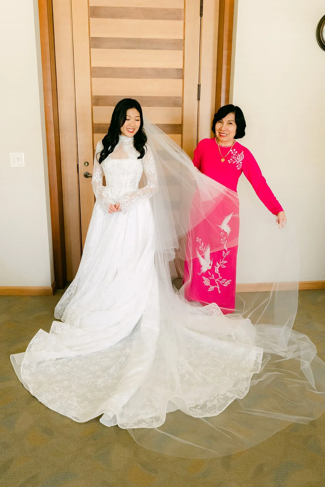 Kim with her mom in a pink ao dai