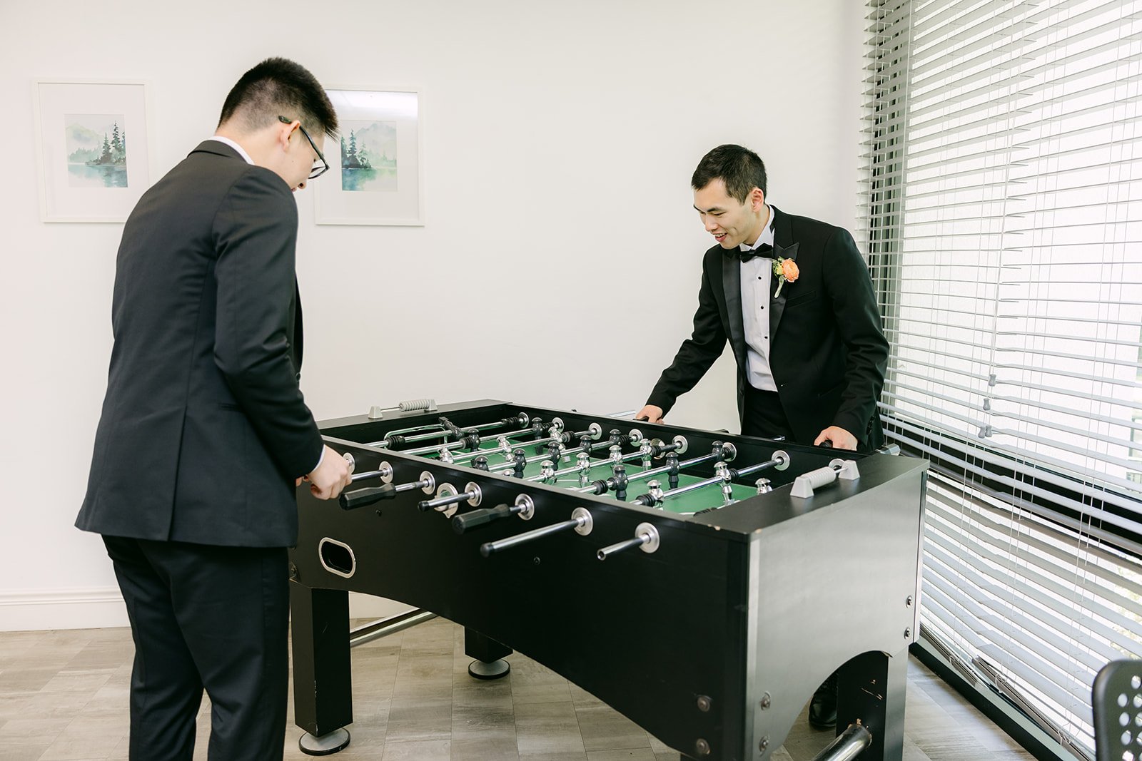 Austin and his groomsmen playing foosball