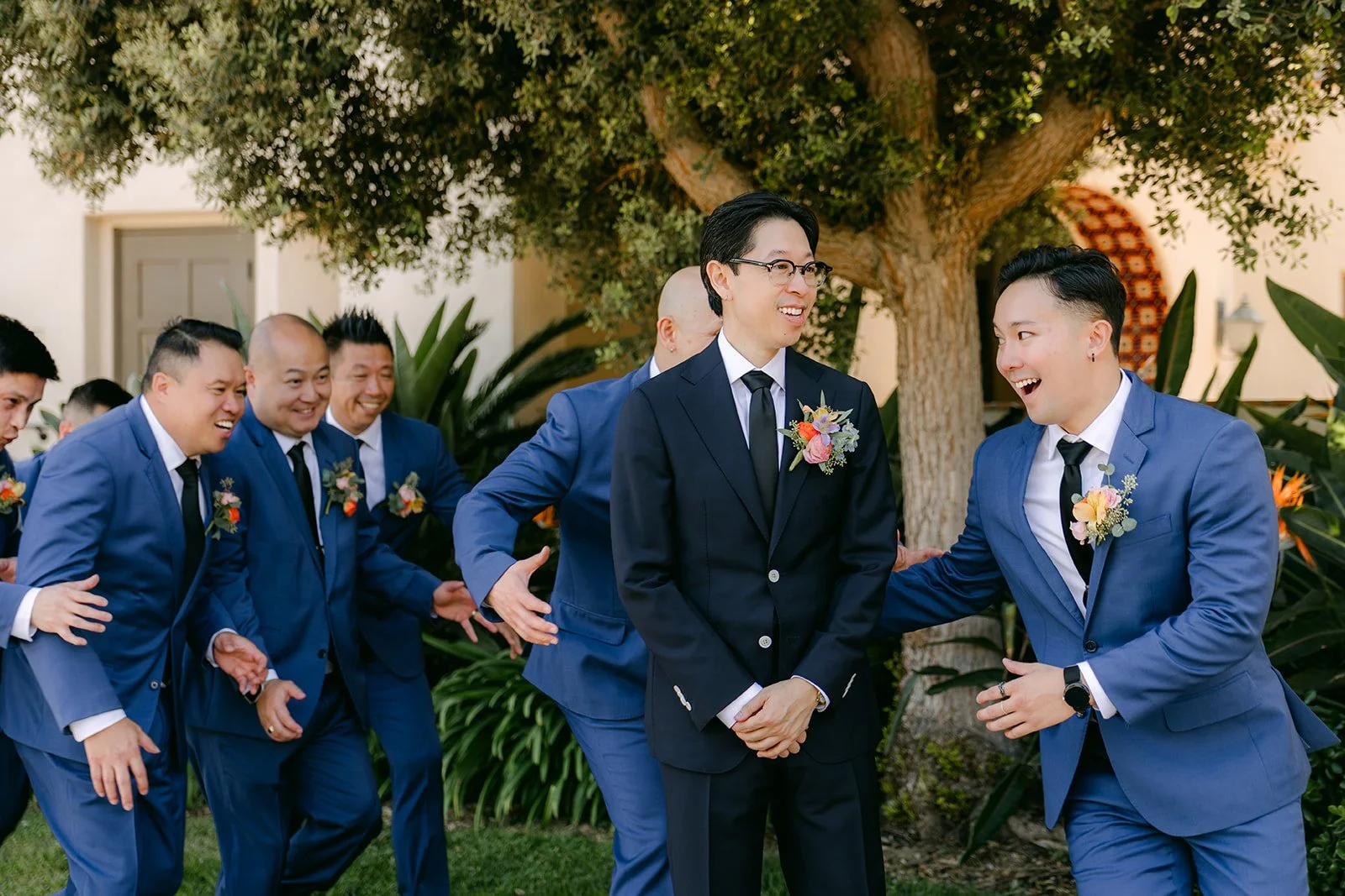 Leroy laughing with his groomsmen