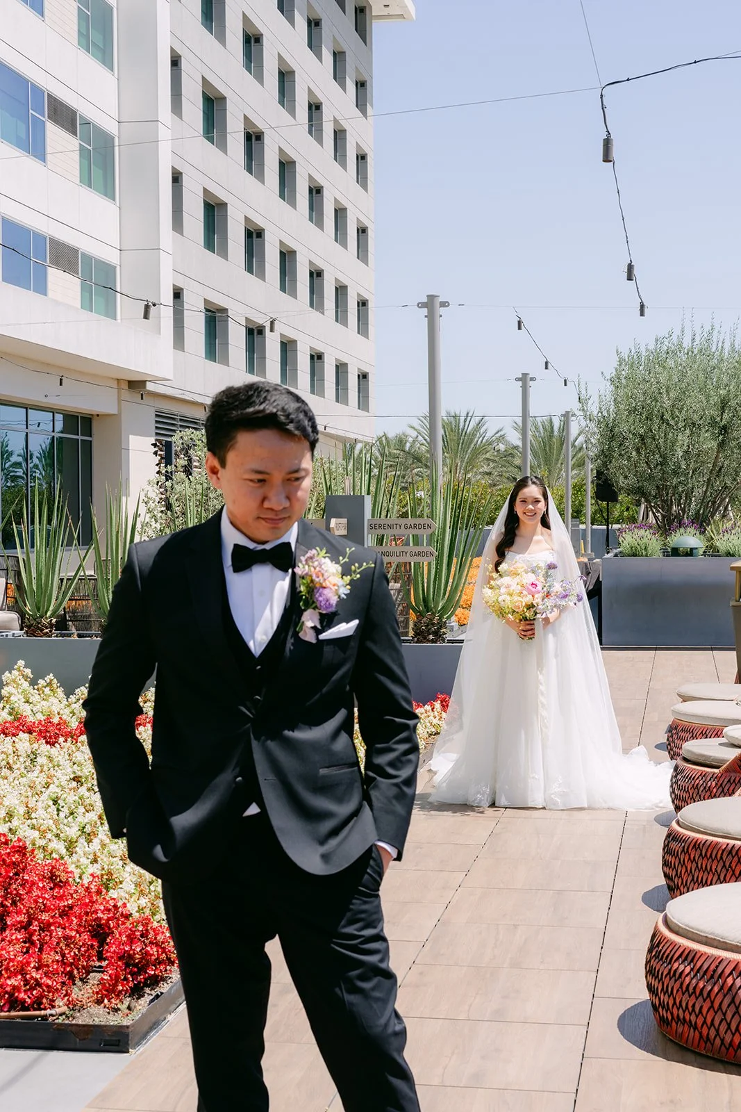 Groom waiting on the garden terrace for the first look at JW Marriott Anaheim Resort