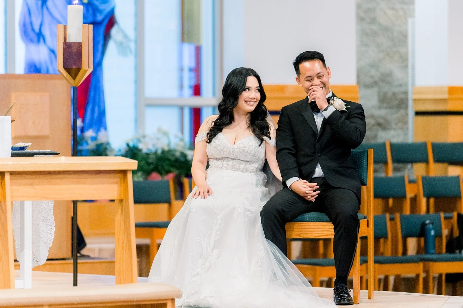 Francesca and Ralph seated at the front of the church during mass