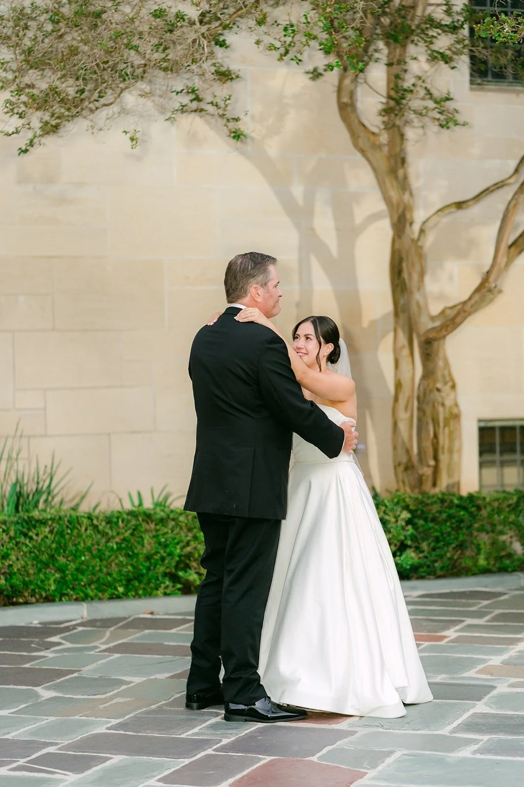 Brianna sharing a parent dance in the courtyard
