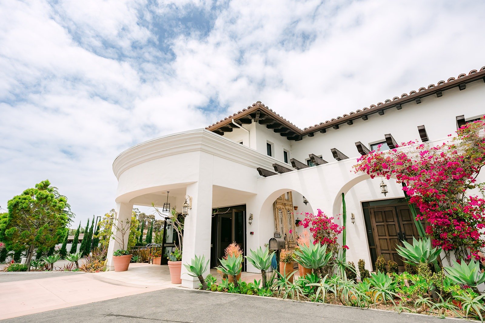 The white Spanish style facade of La Ventura Event Center in San Clemente