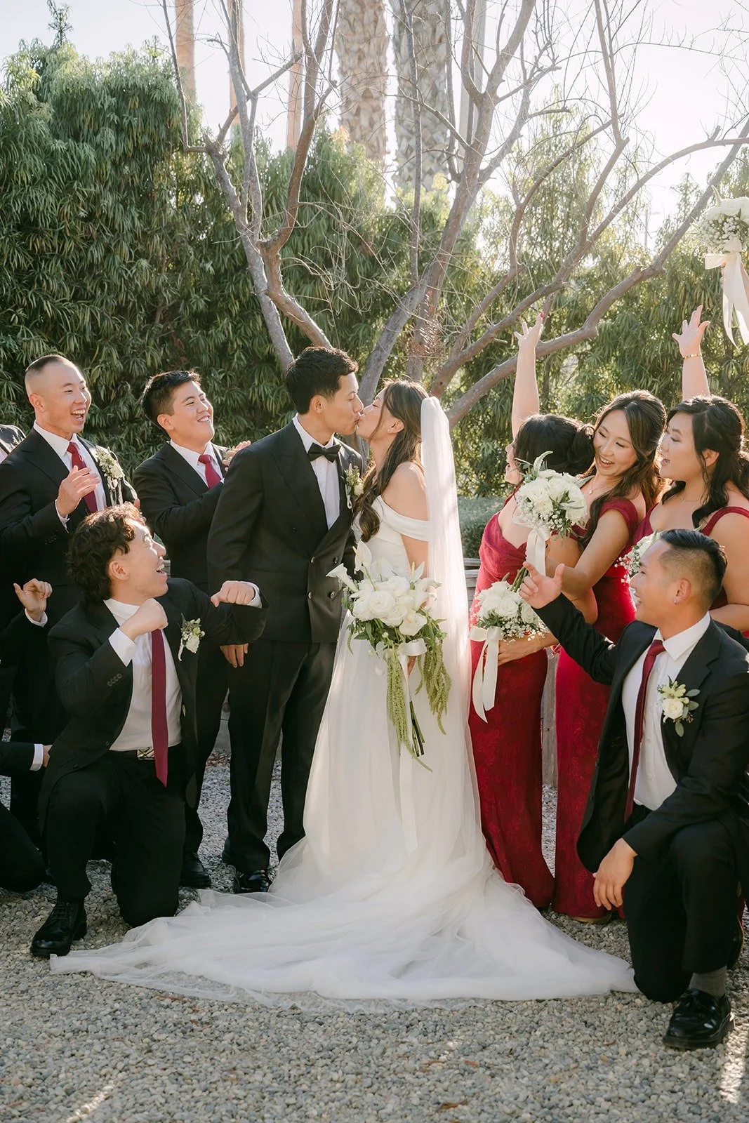 The wedding party cheering around Jadee and Richard