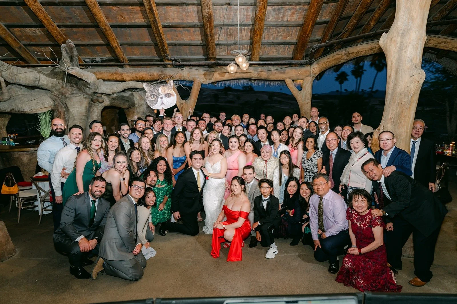 Joanne and Zach with all of their guests in a big group photo under the pavilion