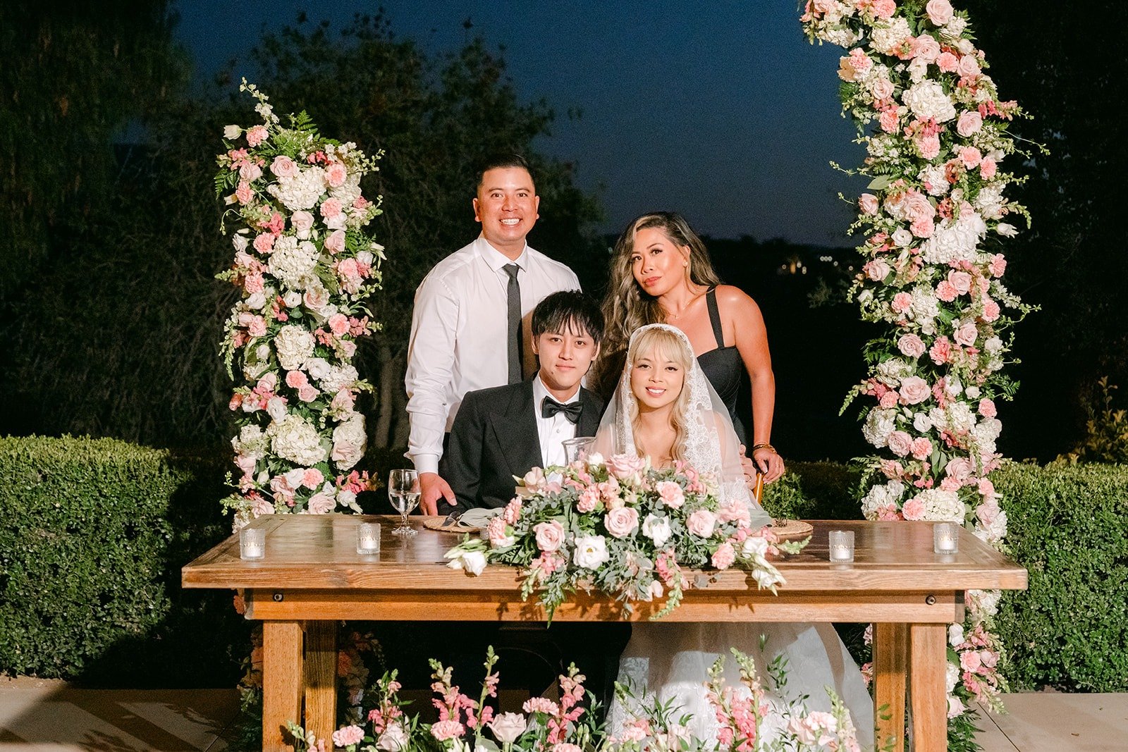 Konitha and Job at the sweetheart table under the night sky