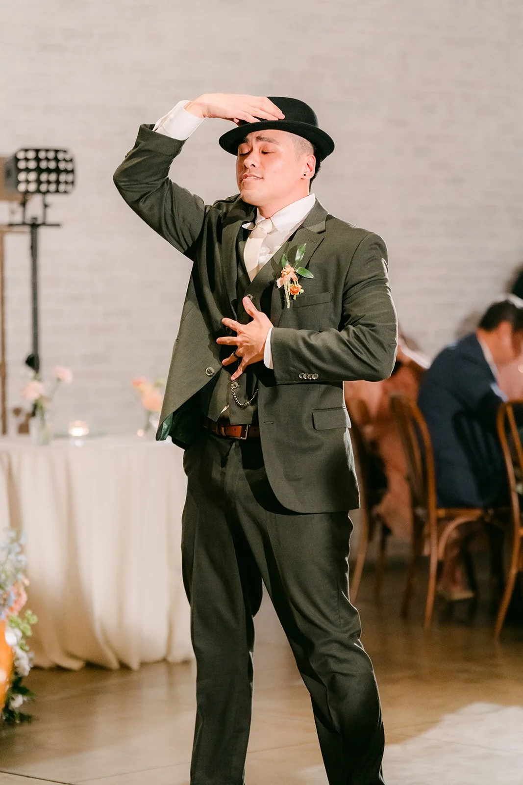 Alex posing in a fedora during his surprise dance