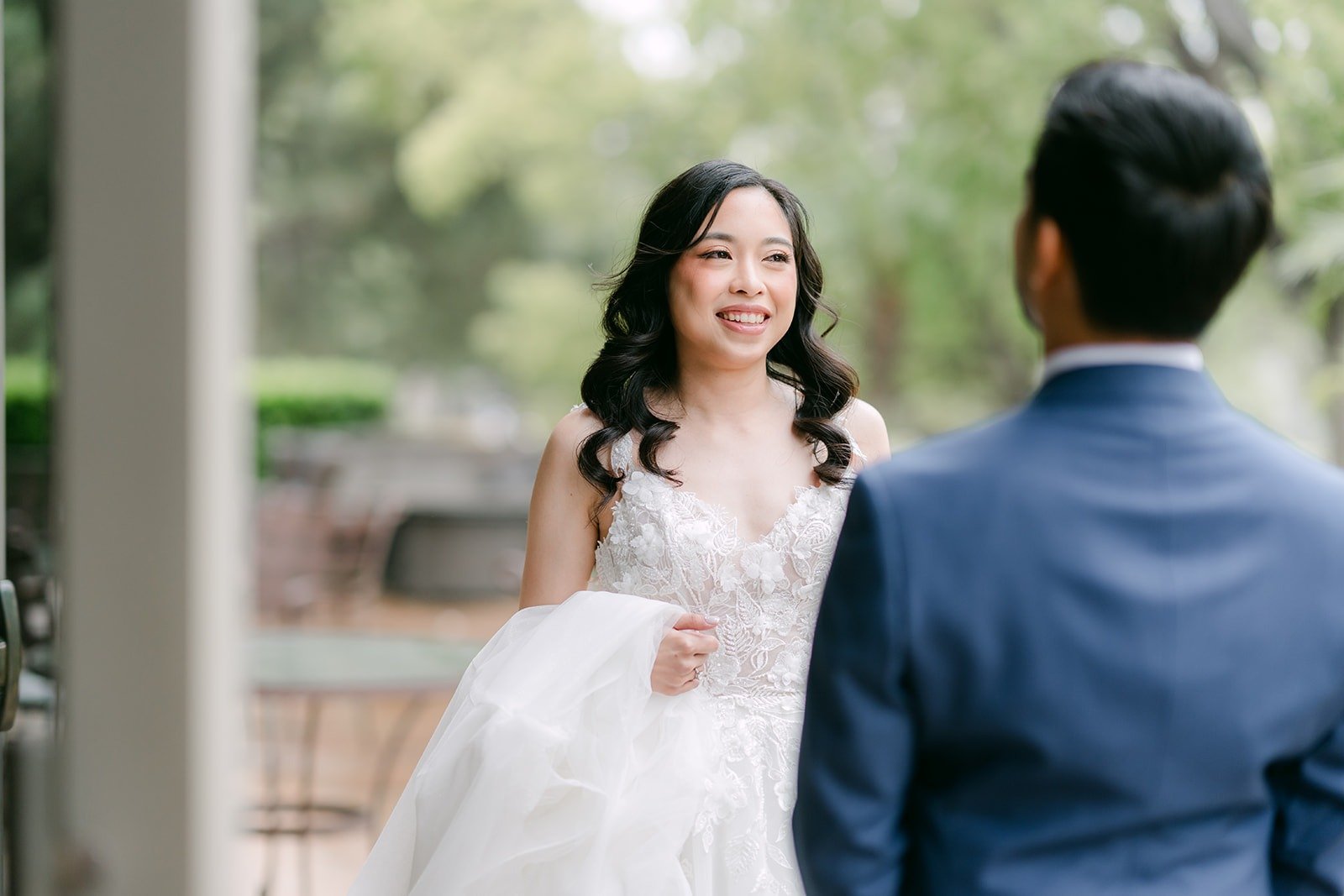 Natalie smiling at Mark as he turns around for the first time