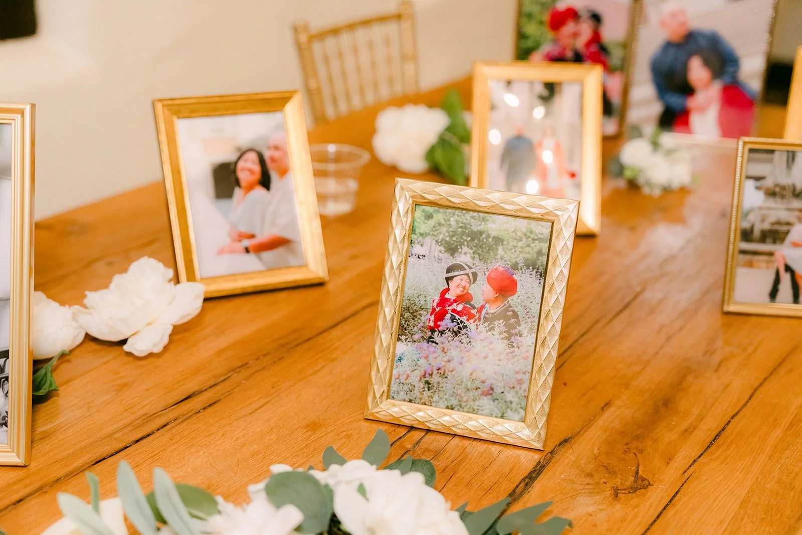 Framed family photos on the memory table