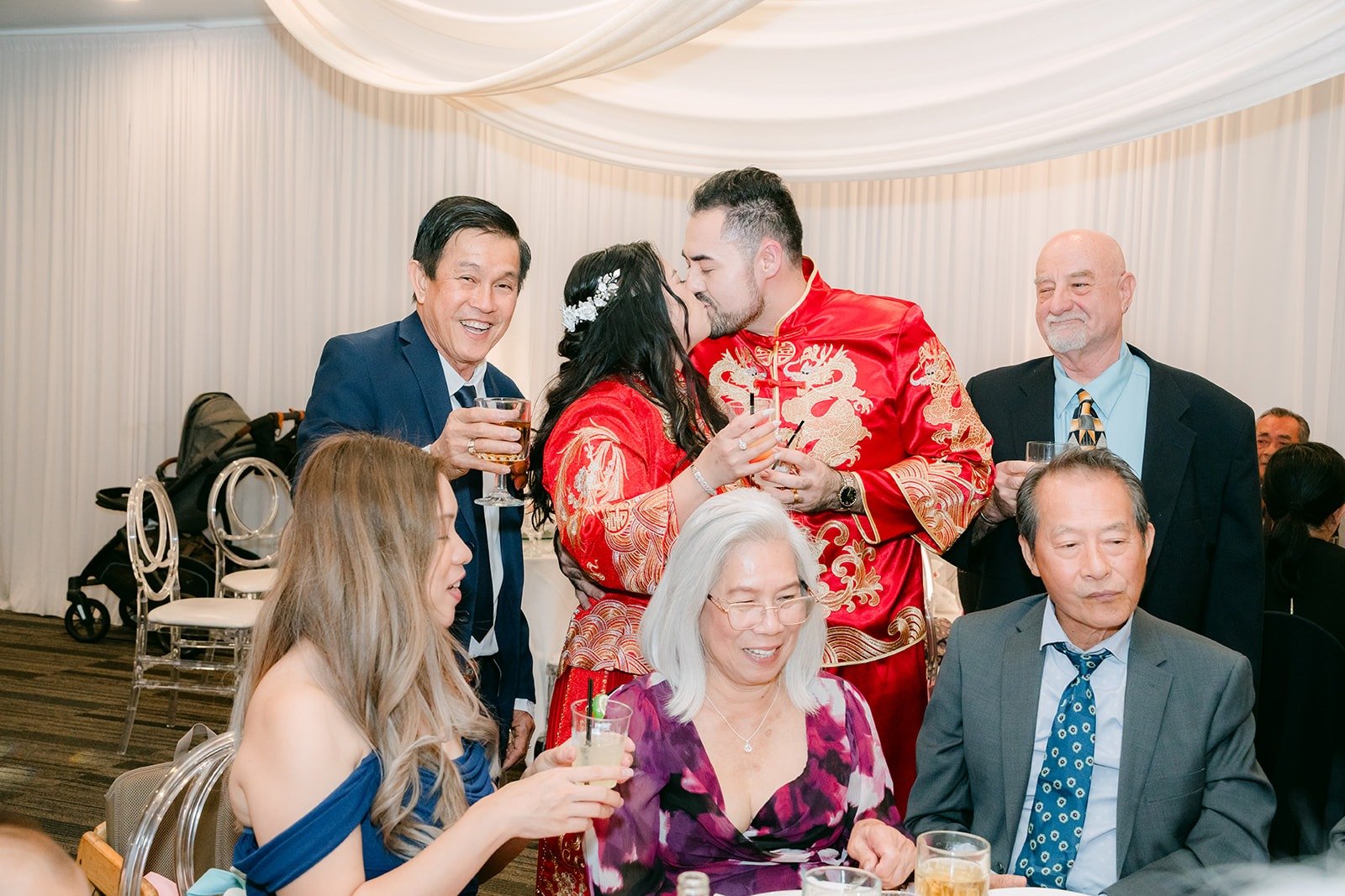 Amy and James posing with relatives at their table
