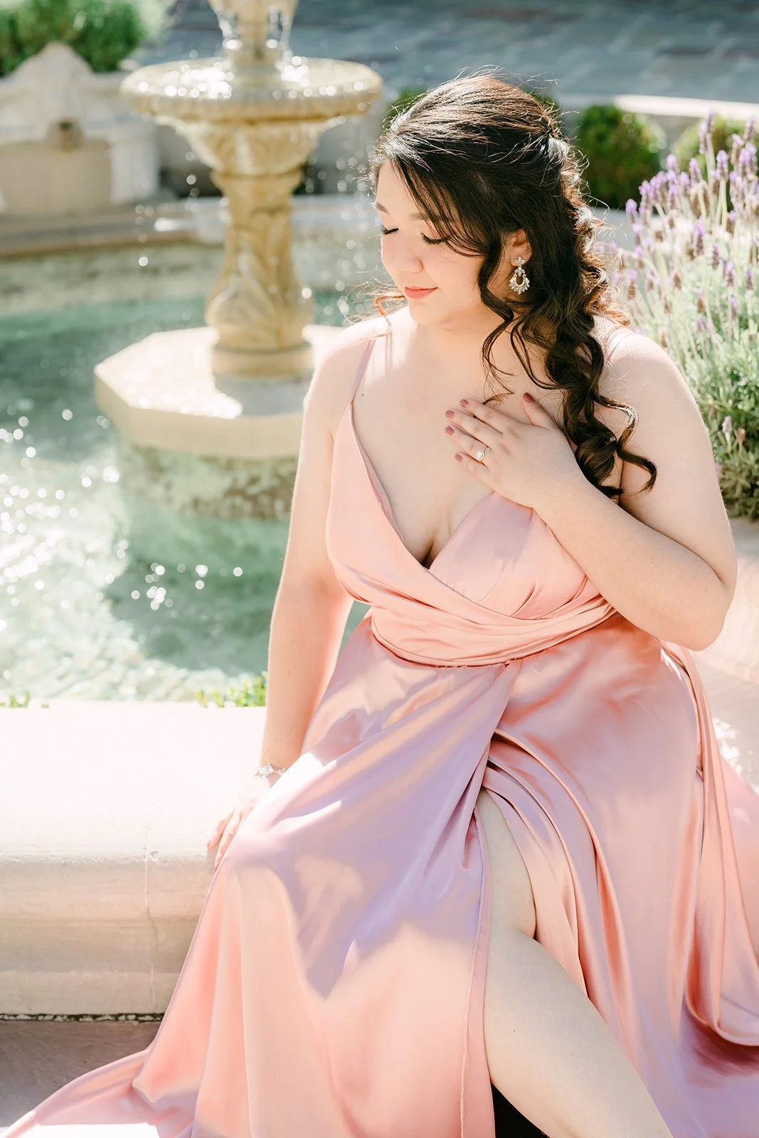 Saira at the edge of the fountain in Greystone's motor court.