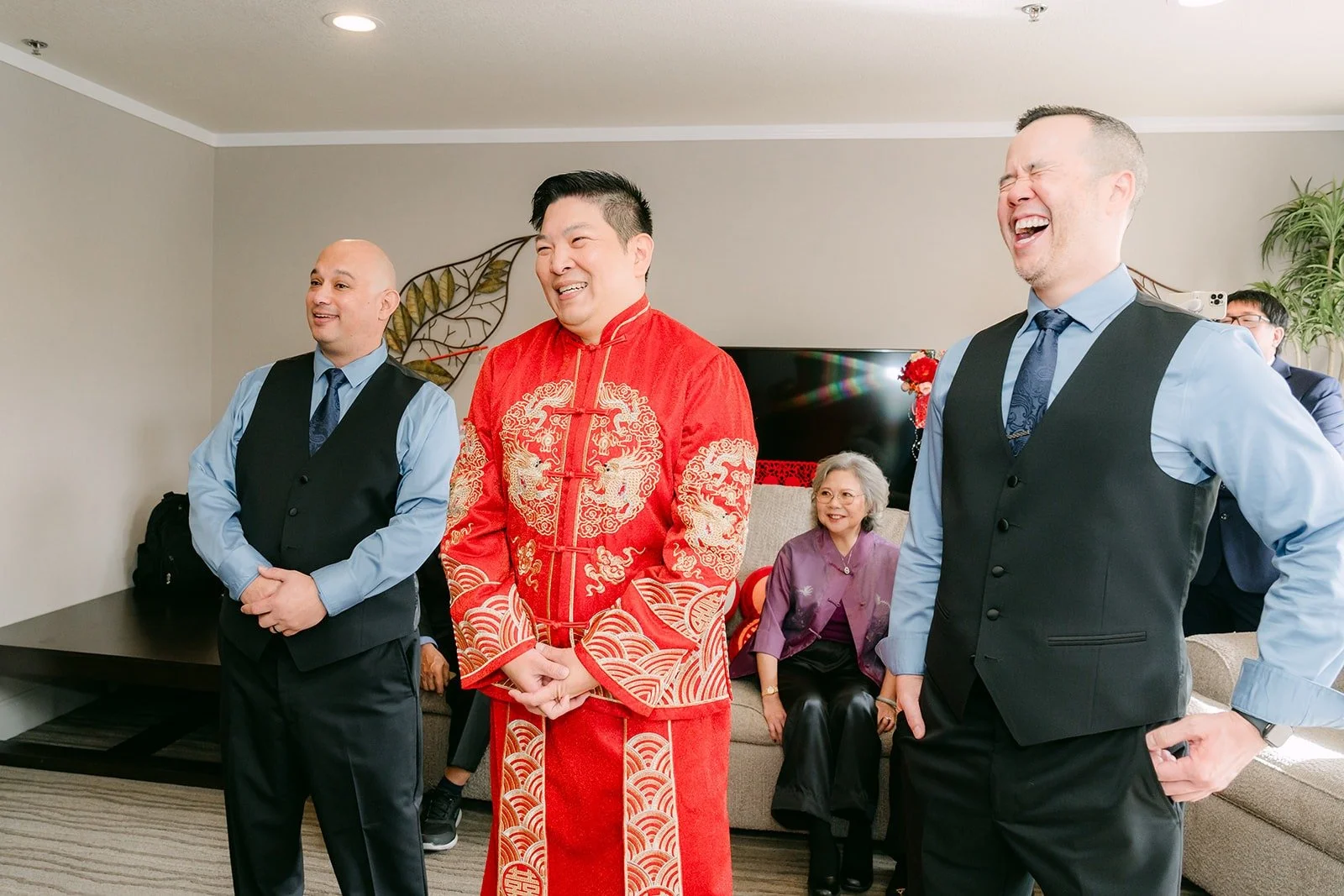 Jay laughs with his groomsmen during the door game