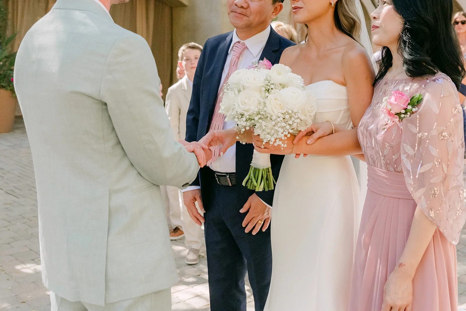 Bride's parents handing her off to Anthony at the altar