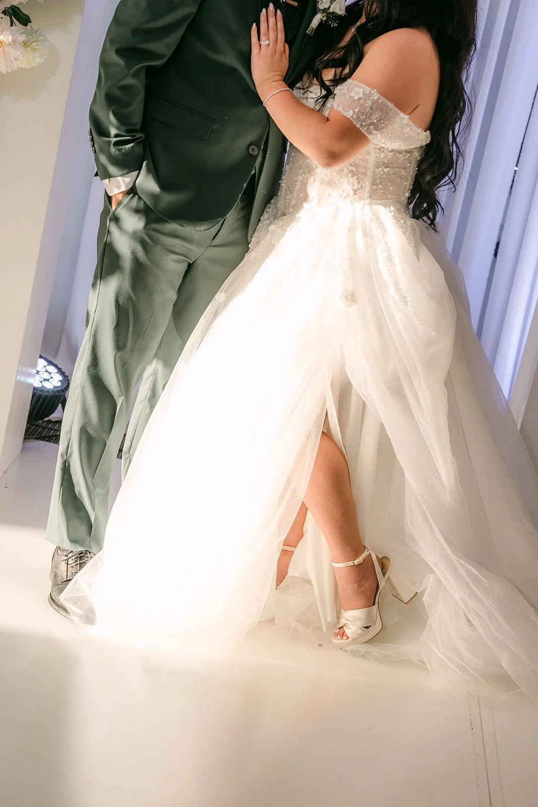 Kevin holds Jennifer's waist as she shows off her gown