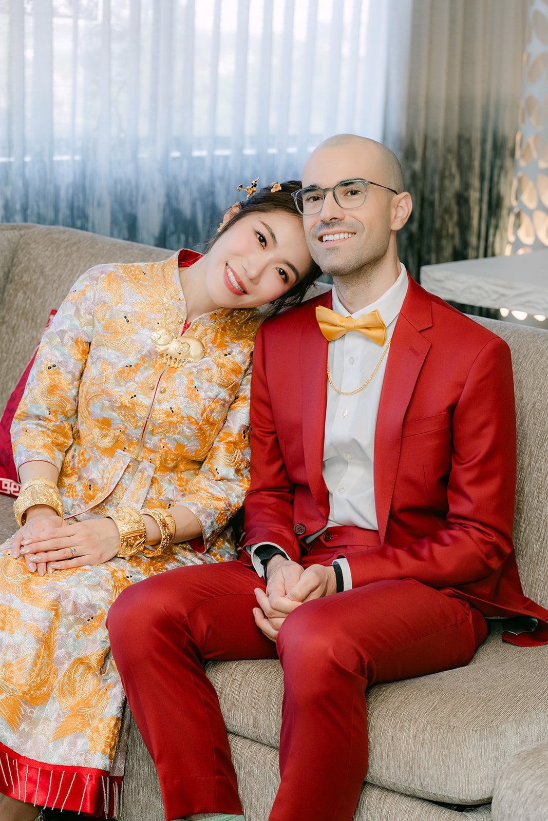 Christie and Christian sitting close together in the suite after the tea ceremony.