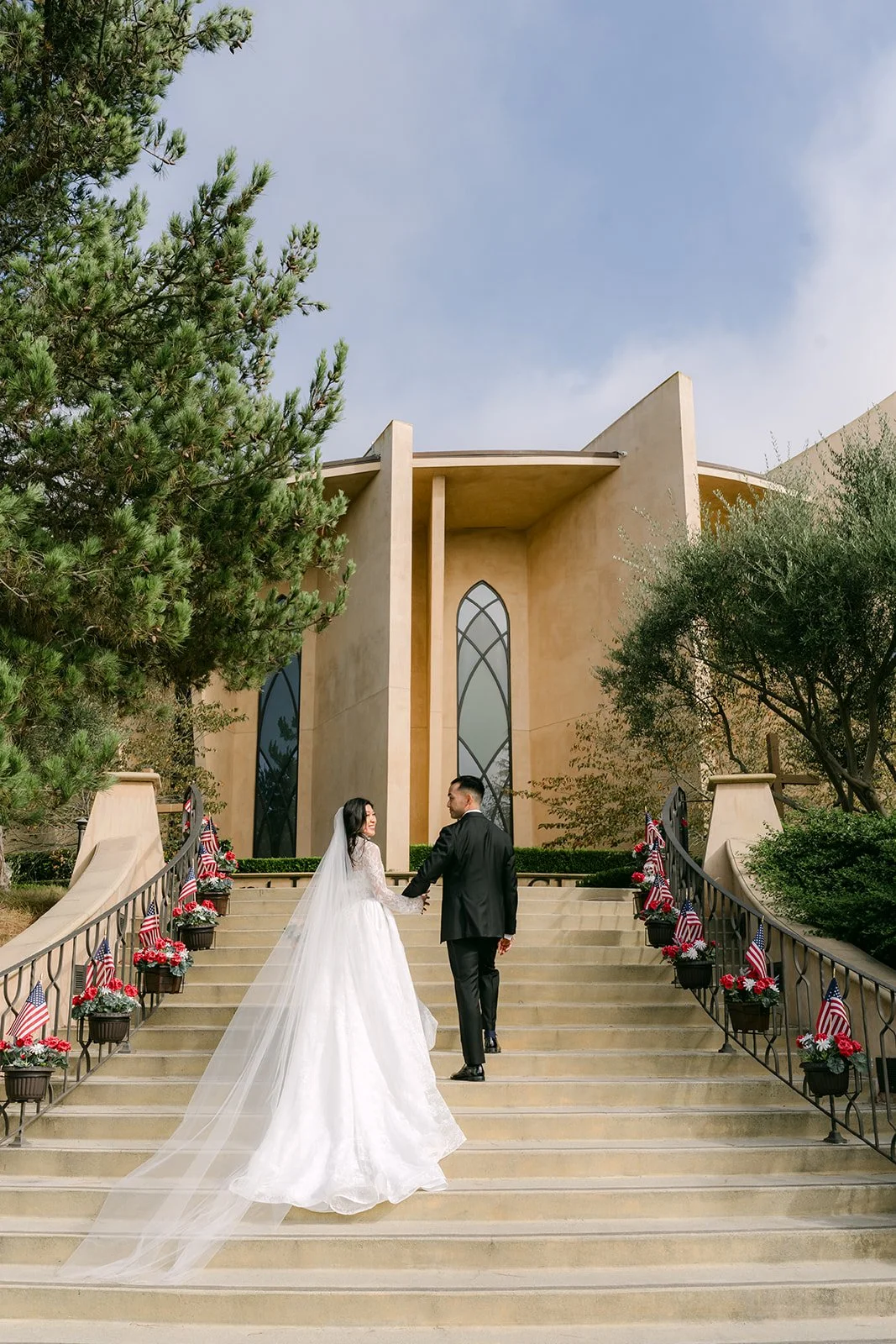 Kim walking up the church steps toward Vincent
