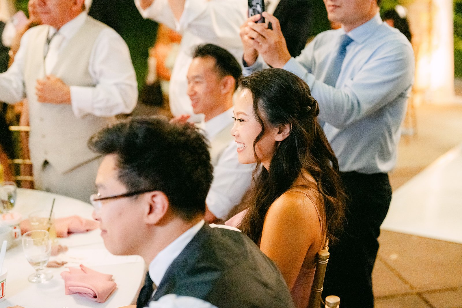 Guests toasting at their table, photographed by One and Only Production.