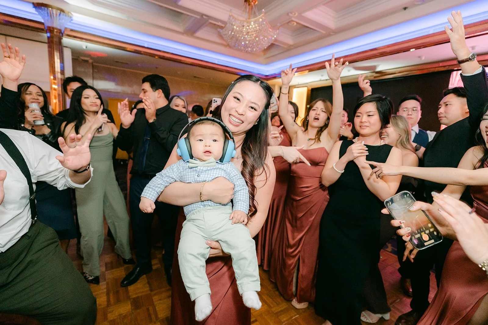 Hands in the air on the crowded dance floor