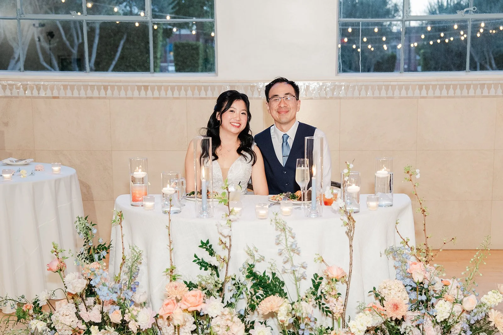 Constance and Lawrence at the sweetheart table in the evening