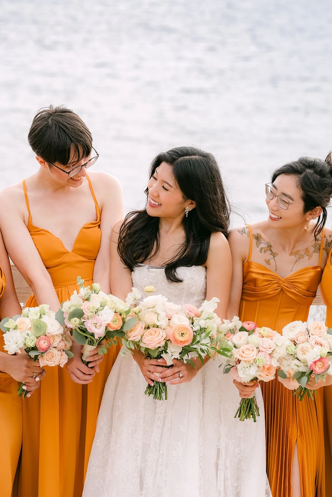 Bridesmaids laughing with Kim on the bluff at Point Vicente