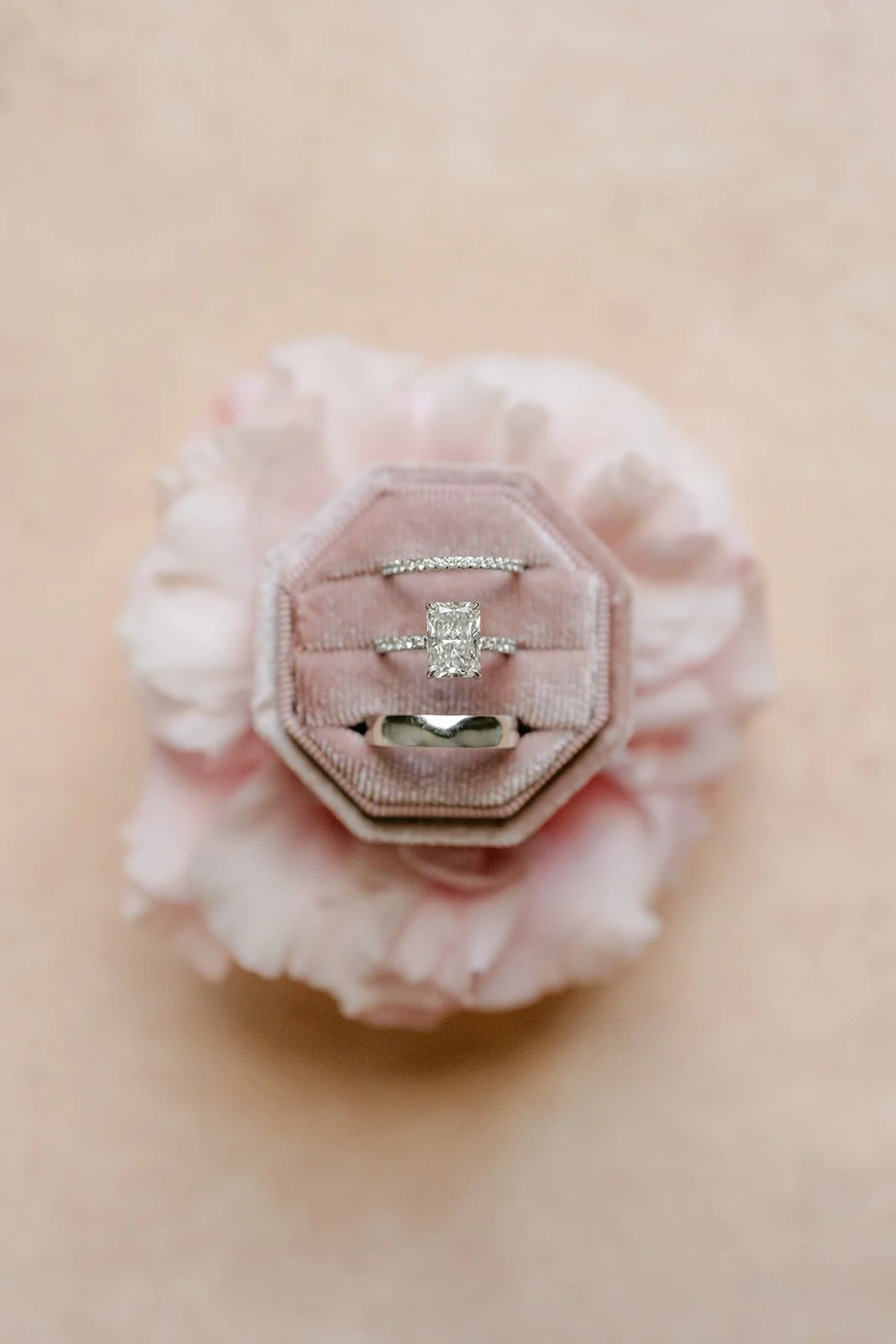 Sandra's engagement ring in a blush rose ring box.