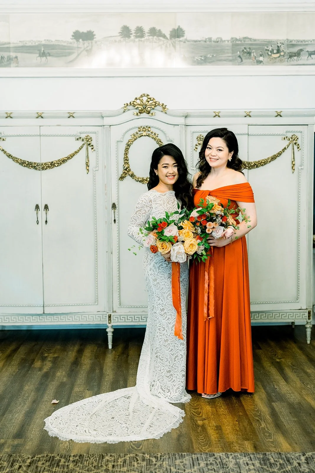 Hannah sharing a hug with a bridesmaid