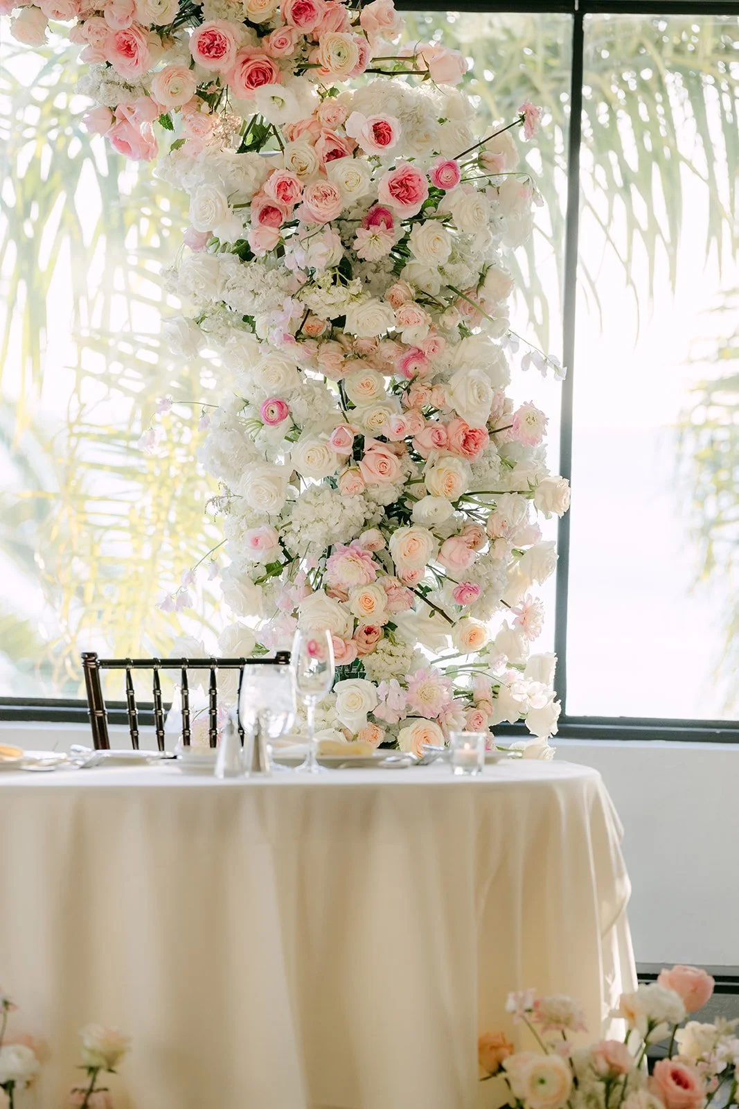 Rose arch rising behind the sweetheart table