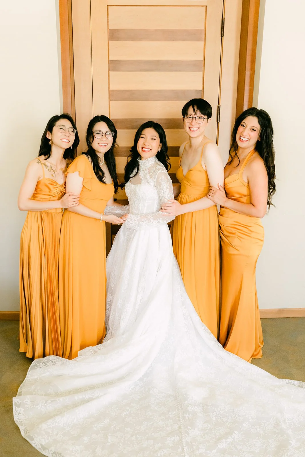 Kim with her bridesmaids in marigold gowns