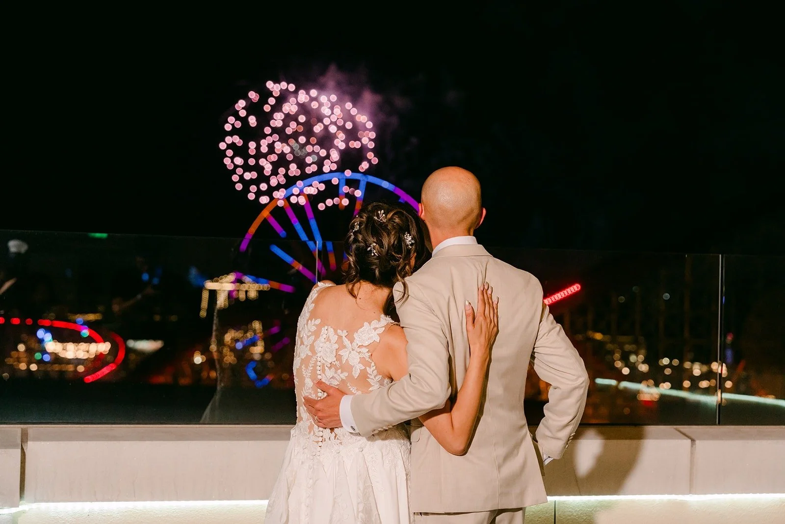 Francesca and Daniel hold each other under the fireworks