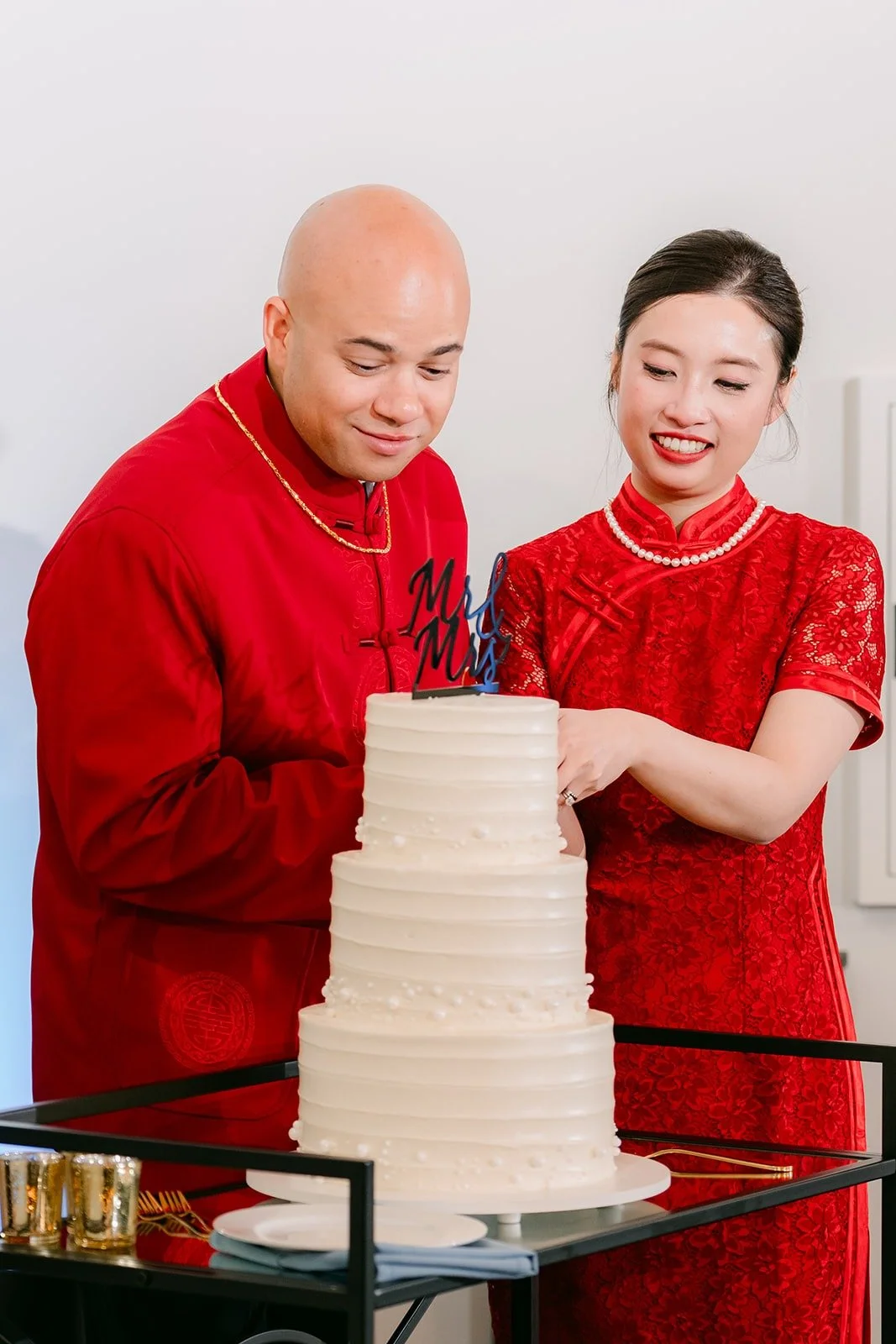 Elisa and Brandon cut their cake together