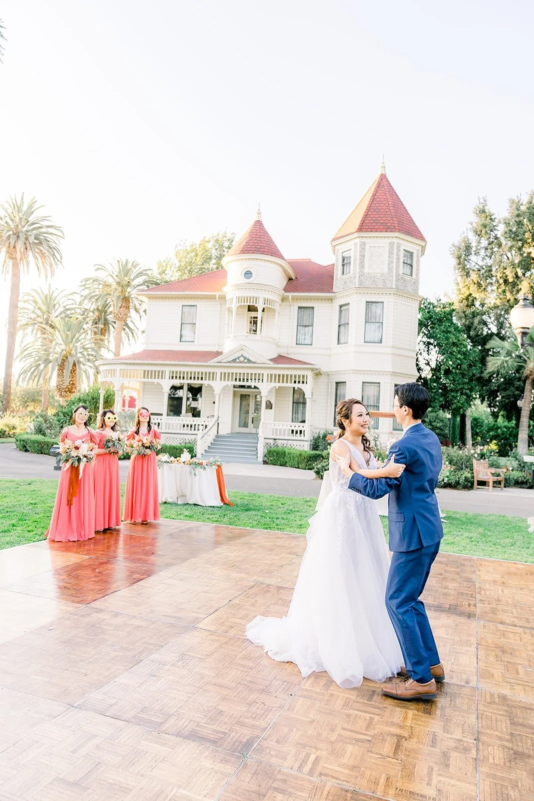 Wide view of the first dance with the Victorian house behind