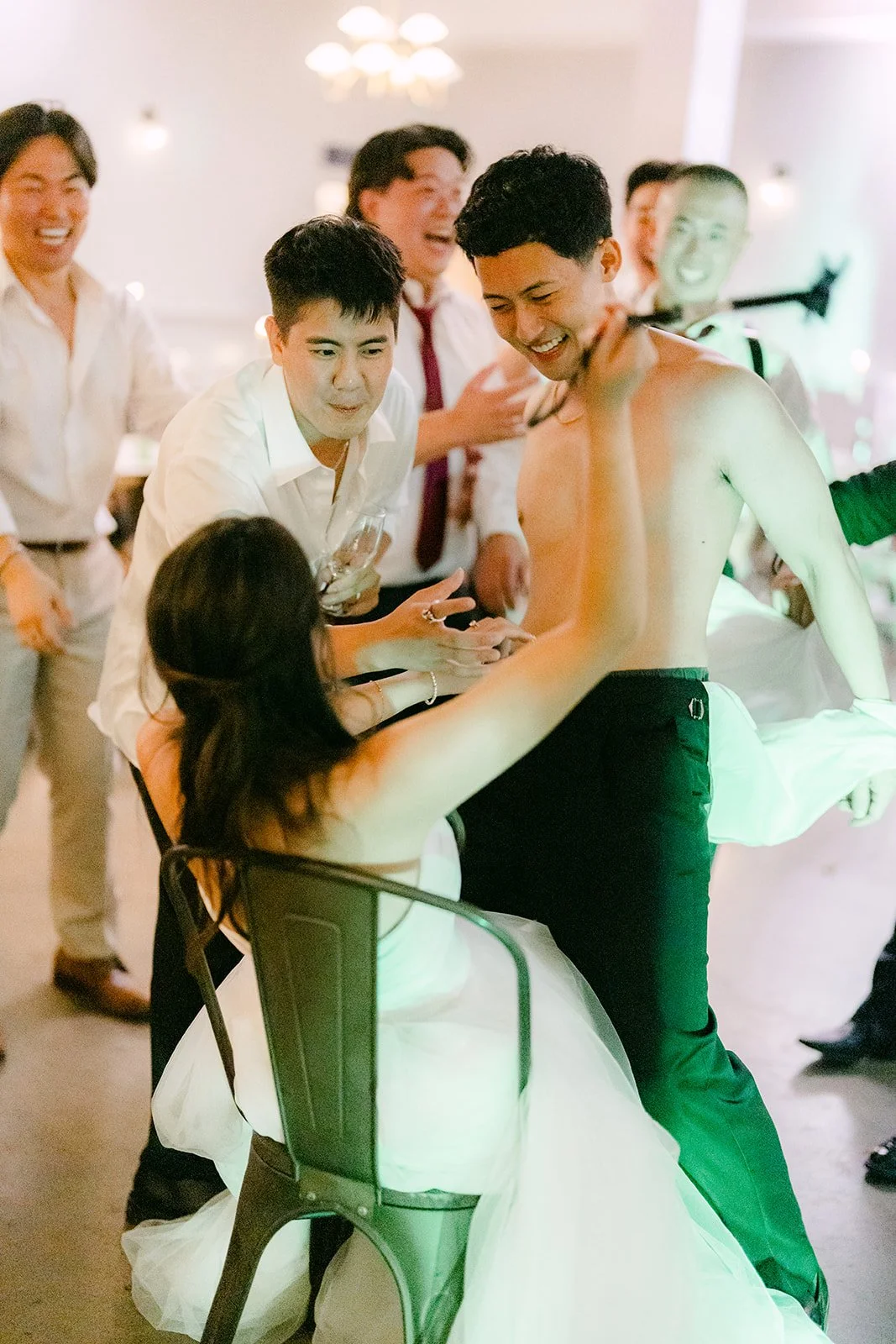 Groomsmen celebrating on the dance floor, photographed by One and Only Production