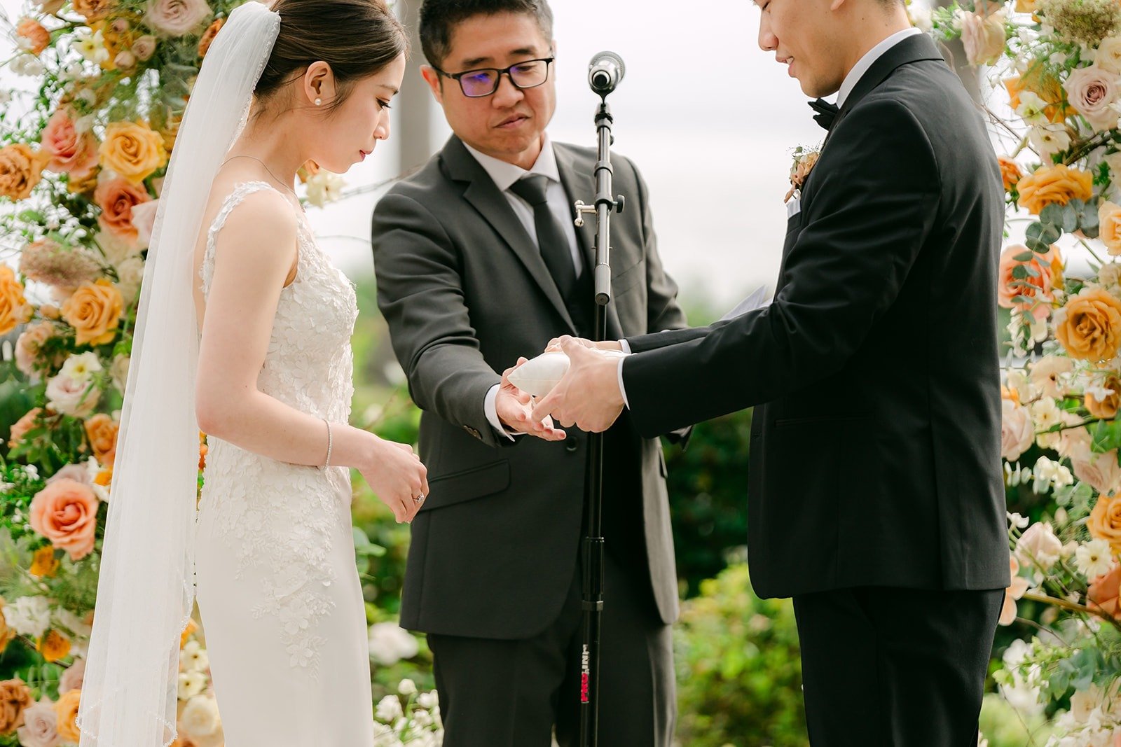 Eli placing the ring on Angela's finger