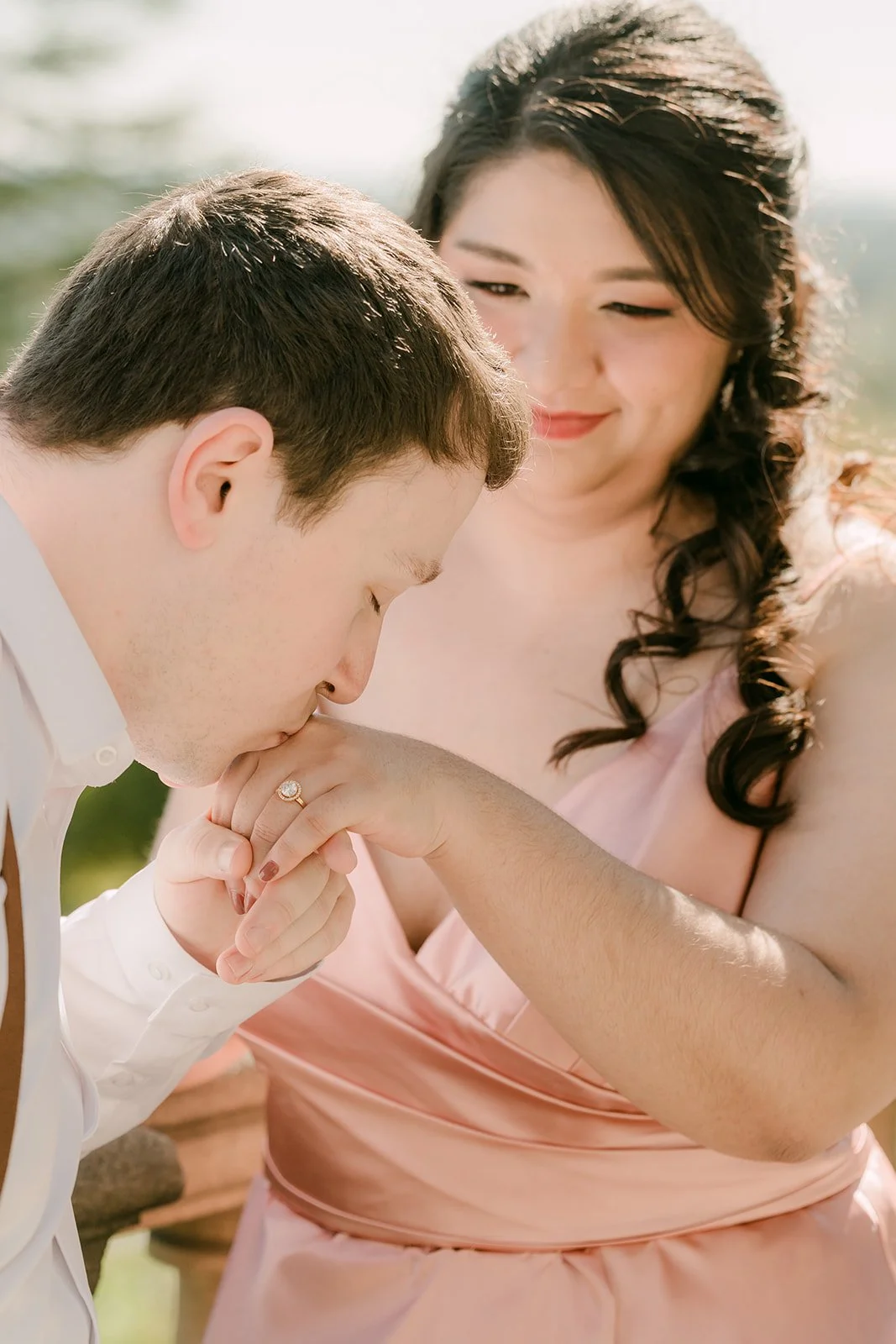 Matthew kisses Saira's hand at the terrace overlook.