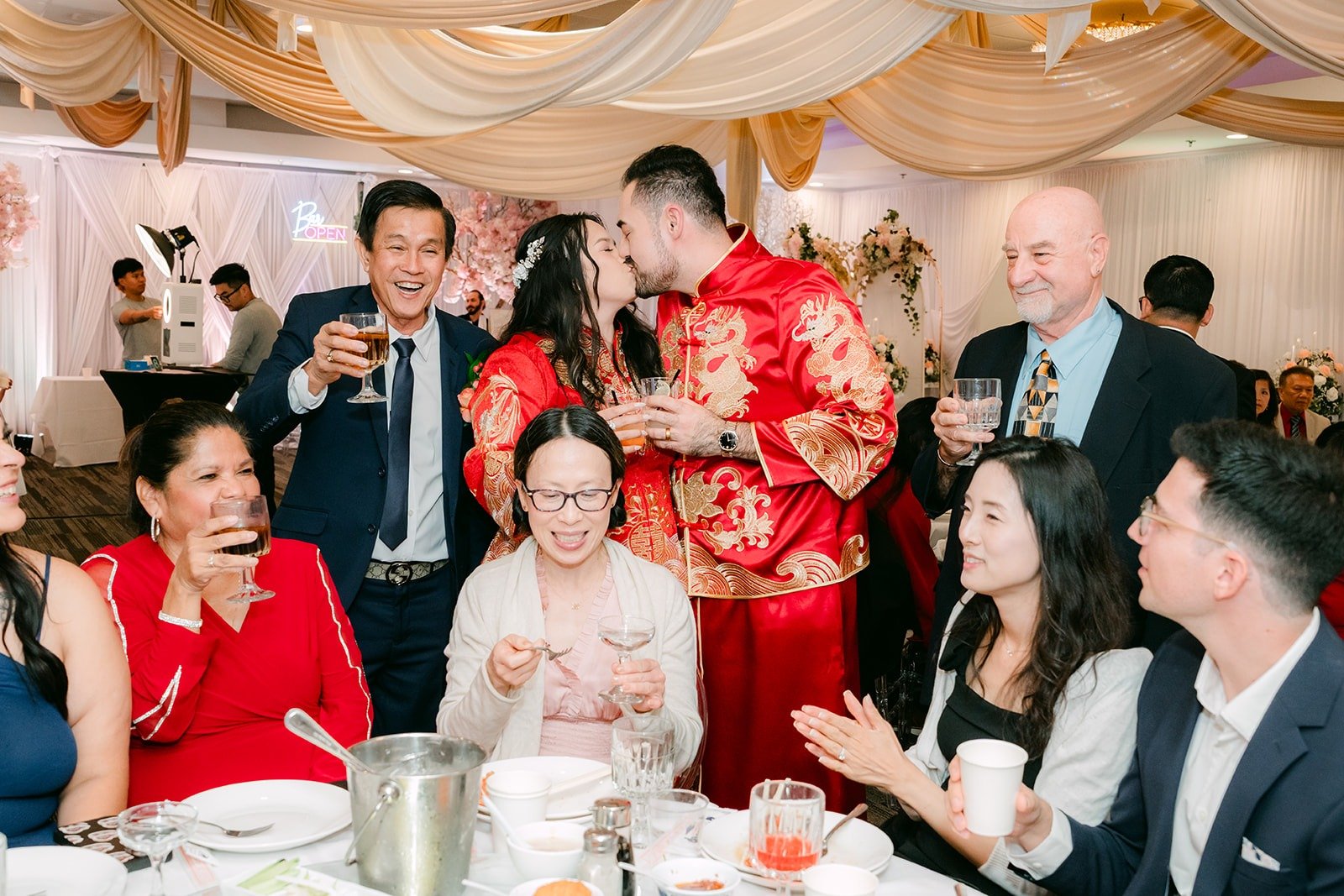 Guests cheering as Amy and James stop by their table