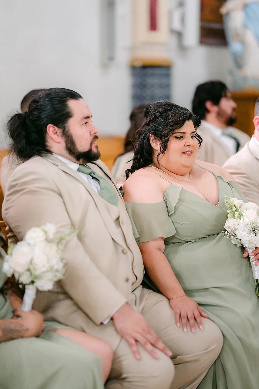 Bridesmaids watching the ceremony from the front pew.