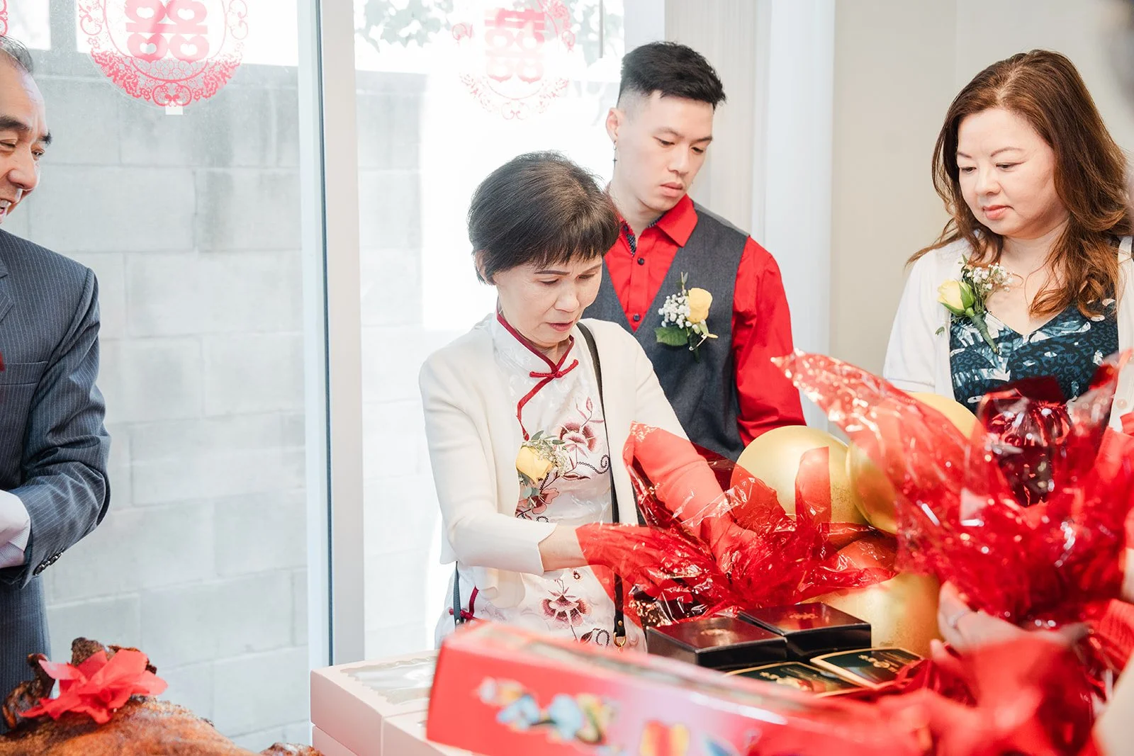Family looking on during the tea ceremony.