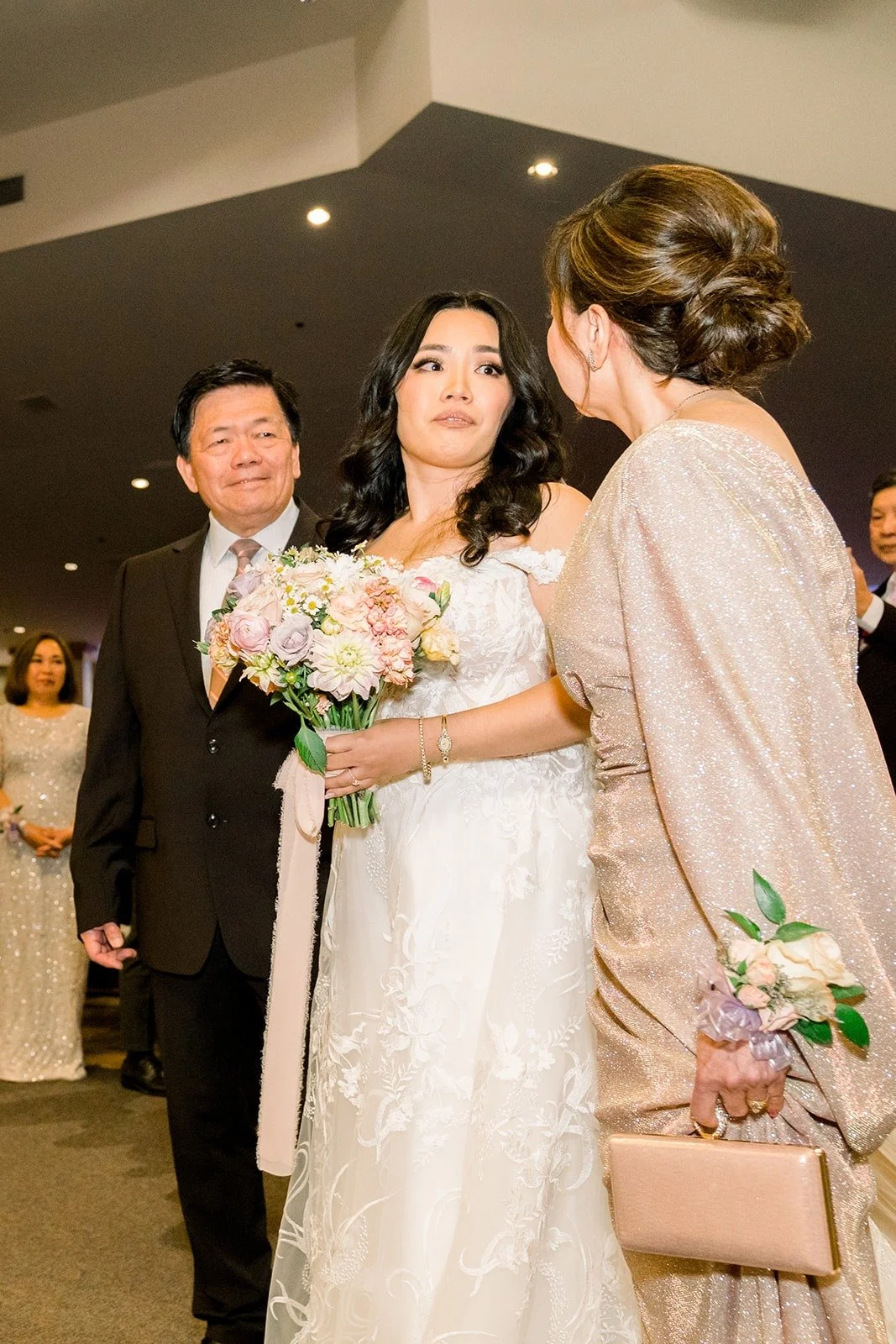 Francesca escorted down the aisle with her bouquet