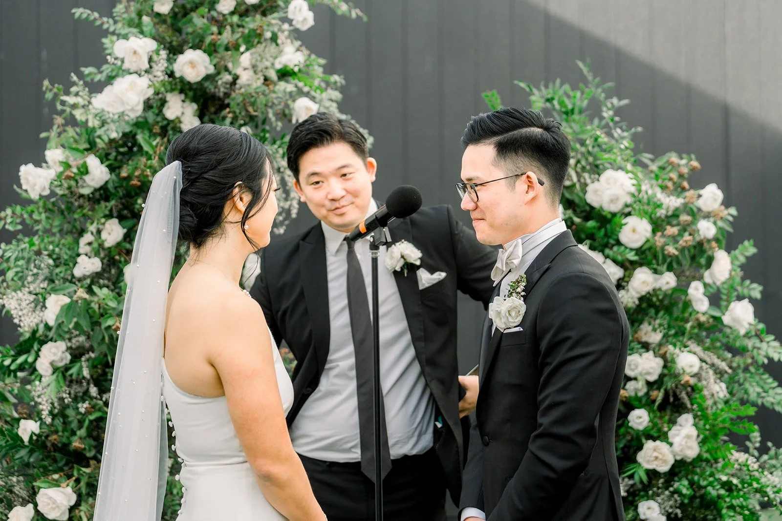 Cindy and Alex face the officiant
