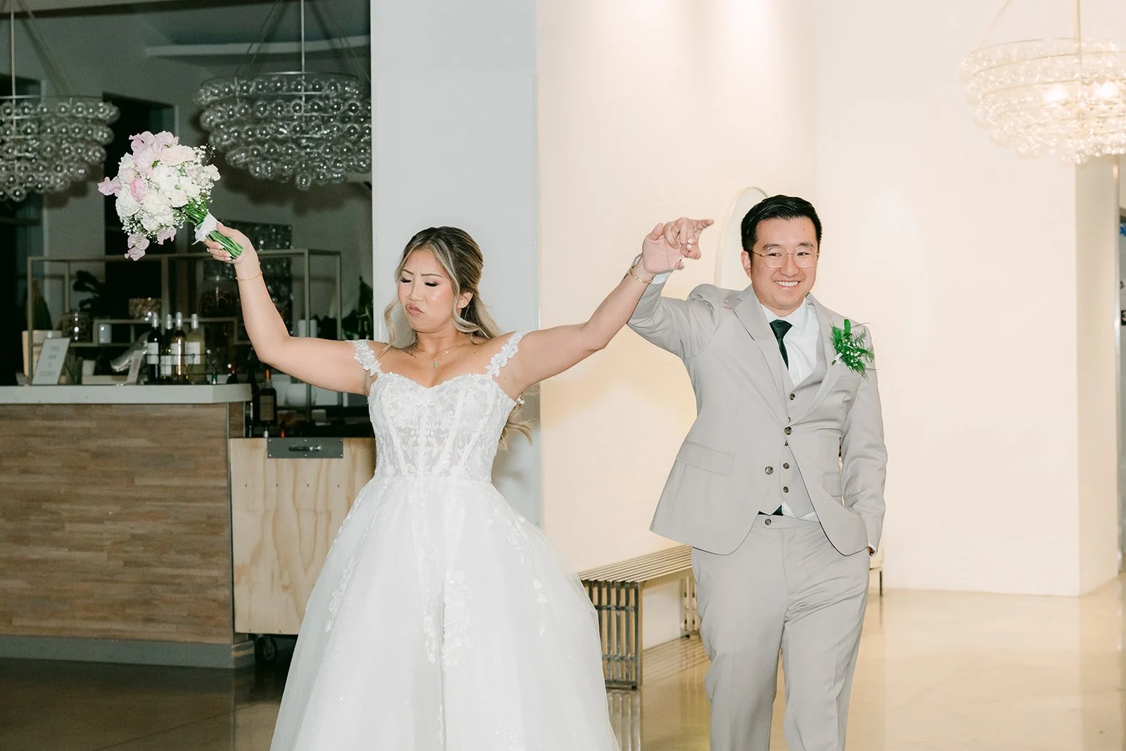Raine and Ricky dancing into their reception at The Modern