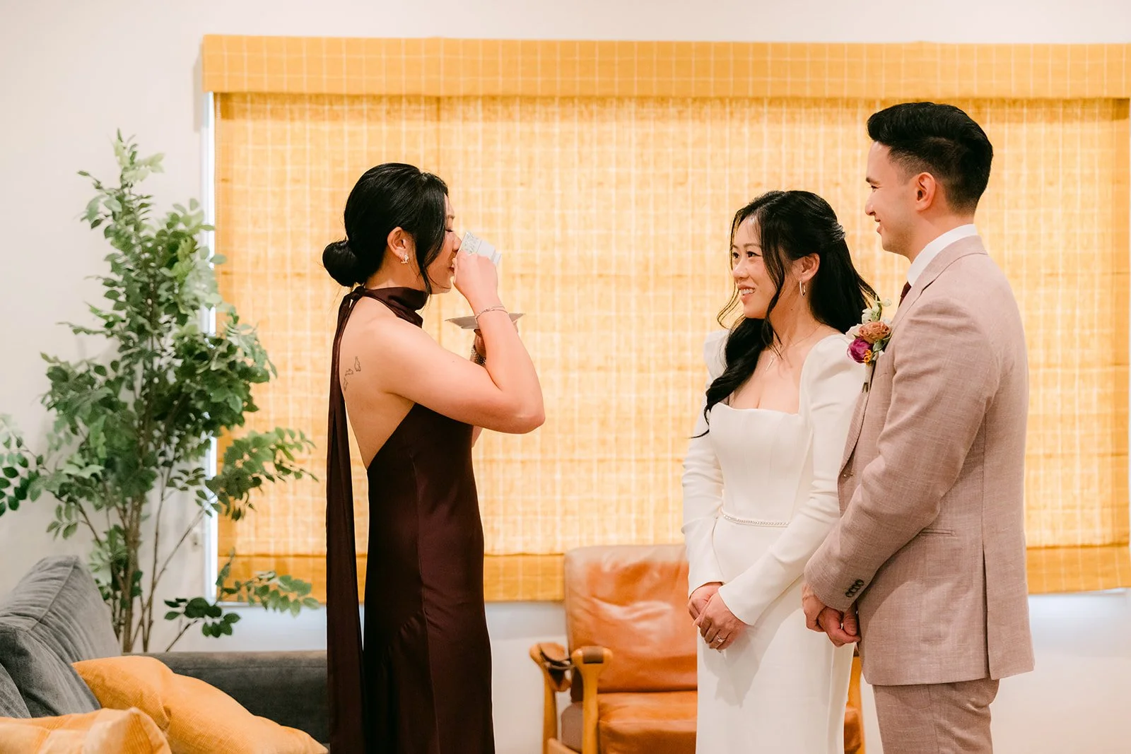 Denise's sister sipping tea served by the couple.