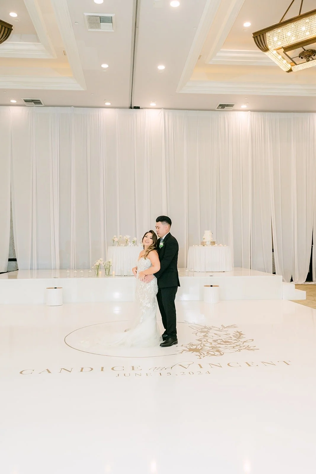 Candice and Vincent on the monogrammed dance floor before guests arrive