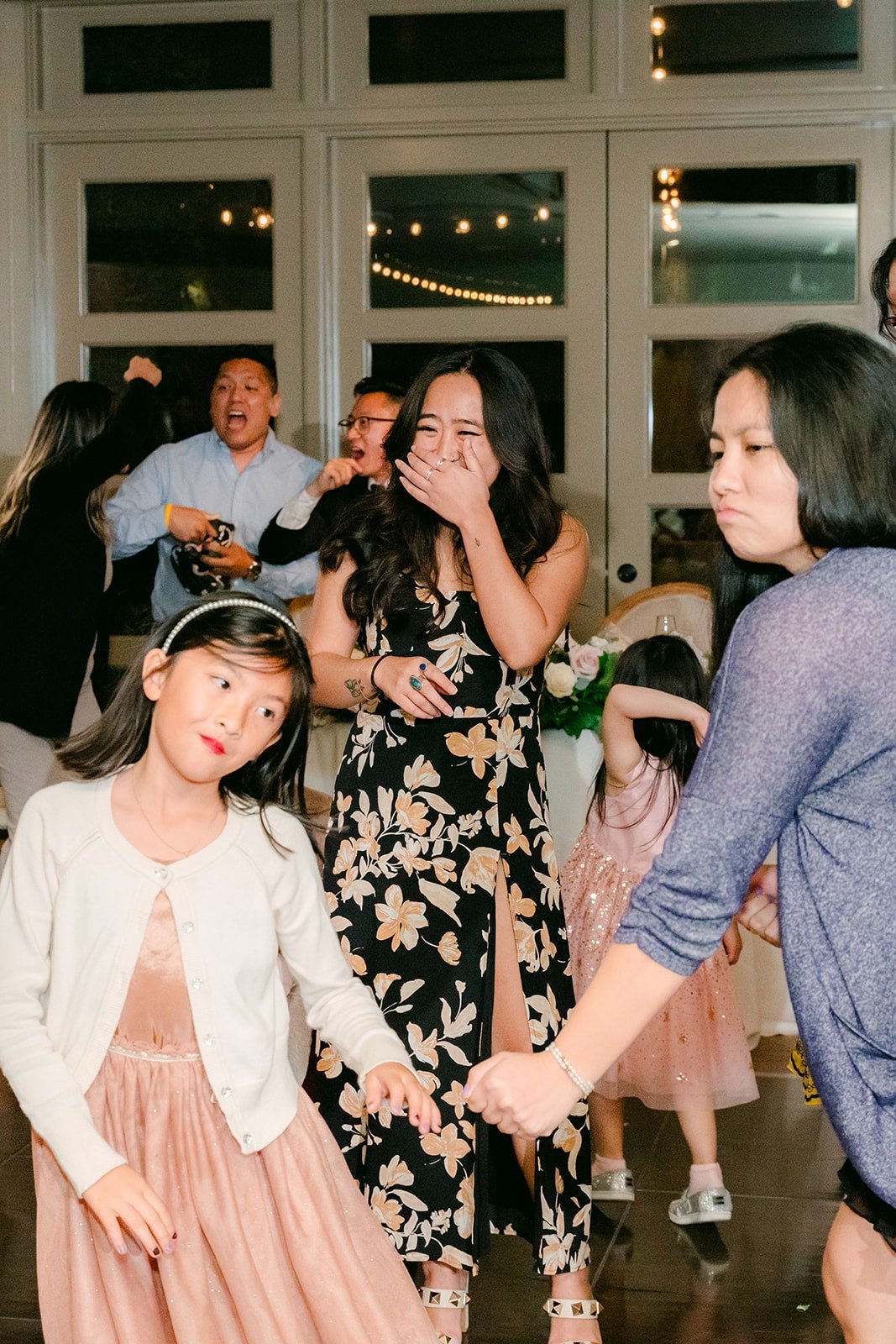 Guests laughing on the dance floor