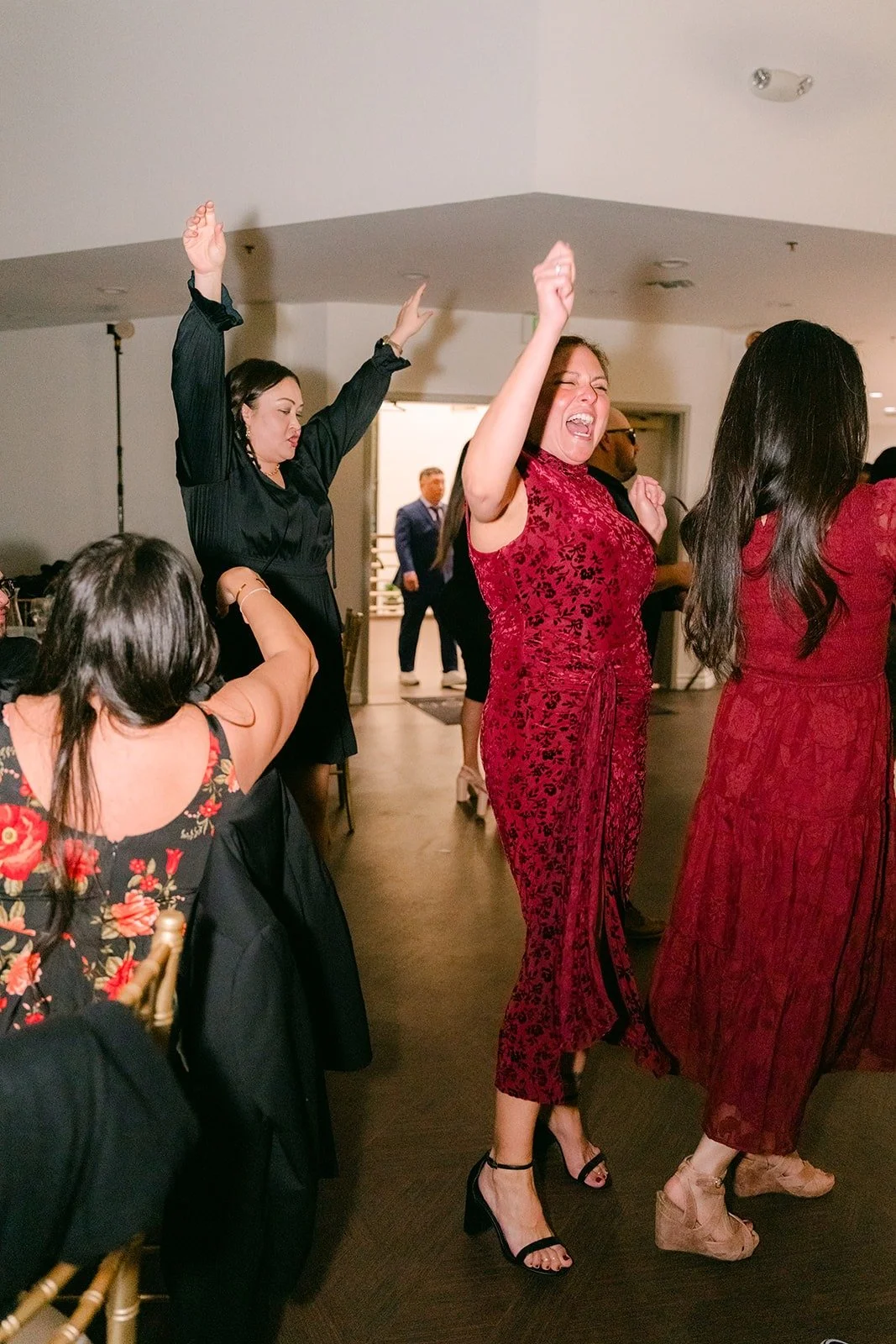 Guests jump and cheer on the dance floor