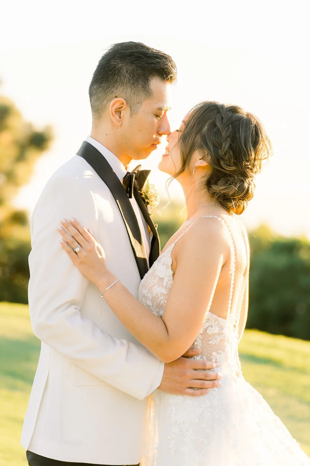 David in a white dinner jacket holding Josephine close